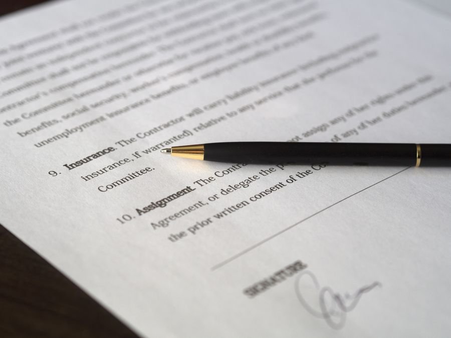 Pen resting on a printed credit report